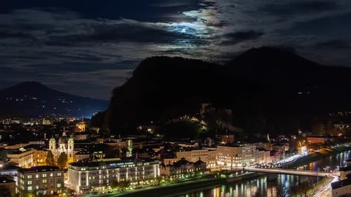 Salzburg Timelapse Skyline At Night: Moonrise, Partly Clouds, and City Lights