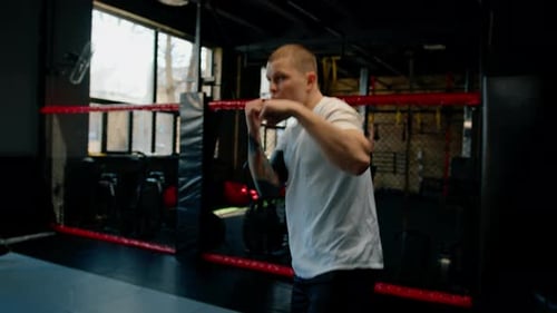 Male boxer training fit man doing boxing in gym young man doing warm up stretching muscles