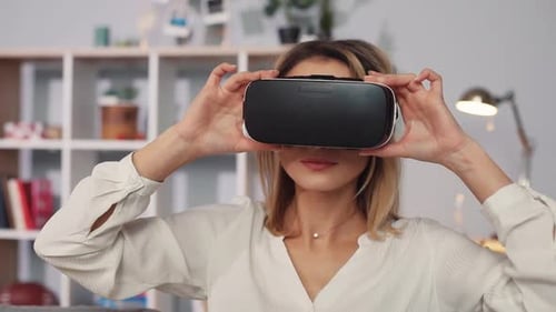 Woman Experiences Virtual Reality with VR Headset Indoors