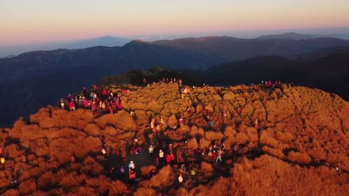 Aerial video of Mount Pulag at sunset with people in the background, the third highest mountain