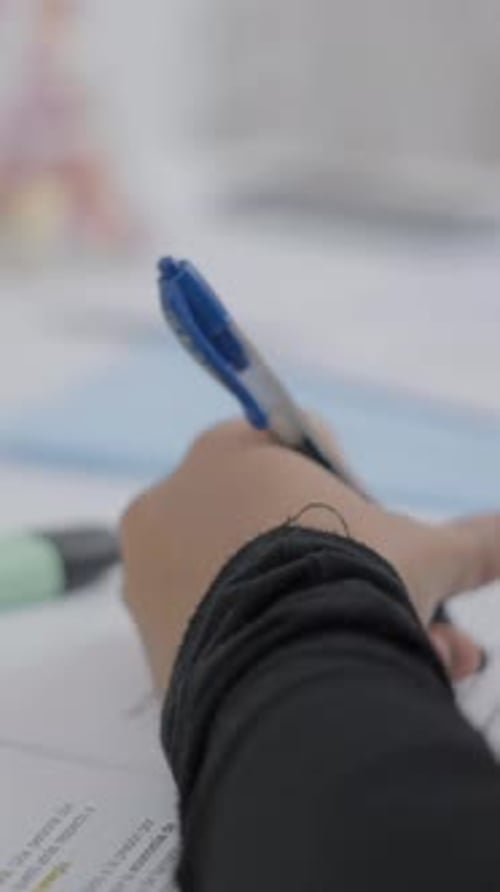 Young Student Watching Lesson Online and Studying From Home Young Woman Taking Notes While Looking