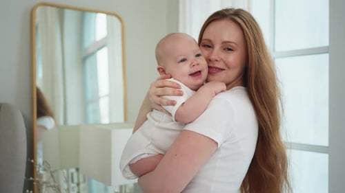 Mother Holding her Adorable Baby