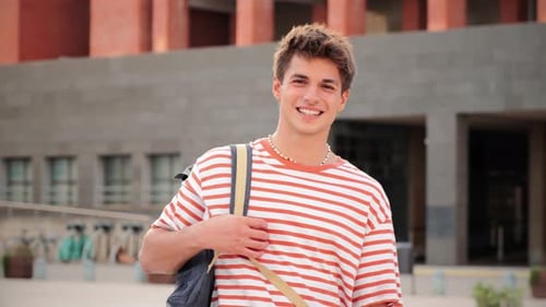 Close Up Individual Portrait of a Handsome Student Young Man Standing at University Campus Happy