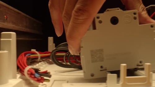 Electrician fixing the electrical appliance.