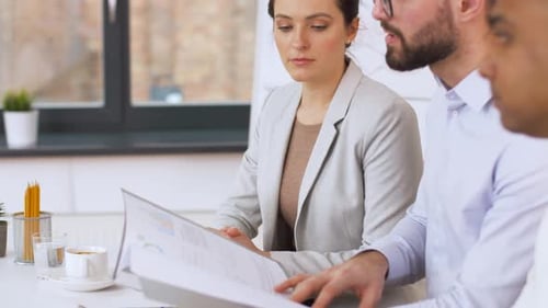 International recruiters interview asian job candidate at modern office