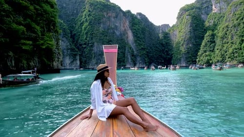 Asian Thai Women in Front of a Longtail Boat at Koh Phi Phi Island Thailand Pileh Lagoon