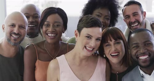 4k video footage of a group of happy businesspeople waving in a modern office