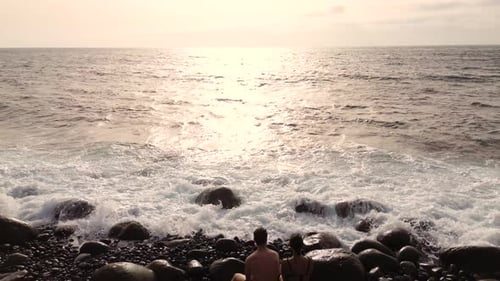 Idyllic scene of two people at unspoiled virgin beach in Gran Canaria, Spain during summer time