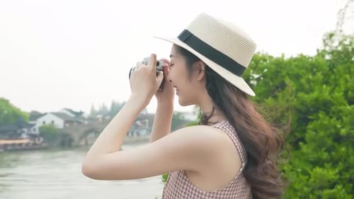 Woman Taking Pictures in Beautiful Location