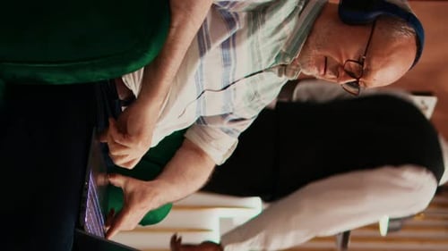 Senior Man with Laptop in Home Office