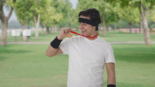 Triumphant Man Celebrating a Sports Achievement in Park