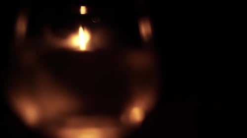 Oil Lamp Flame Flickering in the Dark at Night