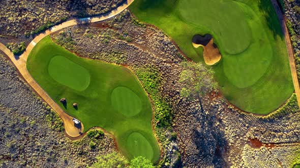 Twisting aerial top down riser above Manele Golf Course, Lanai, Hawaii ...