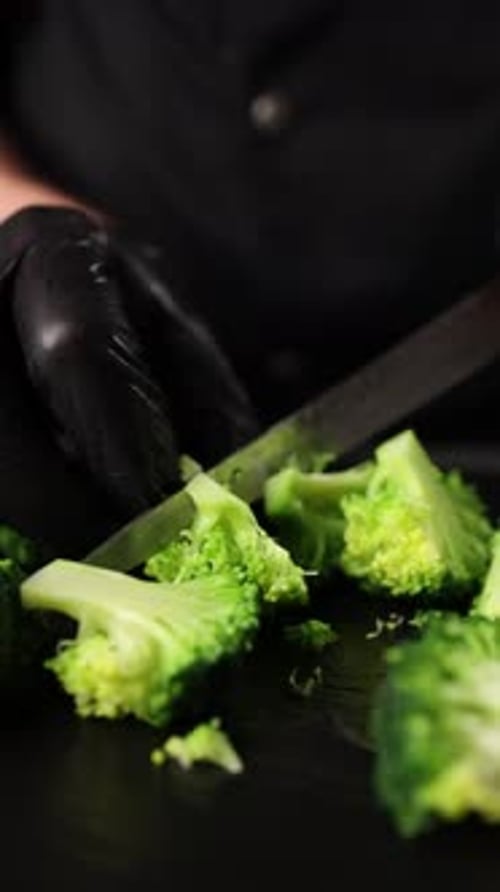 The chef prepares a vegetable dish. Cooking broccoli