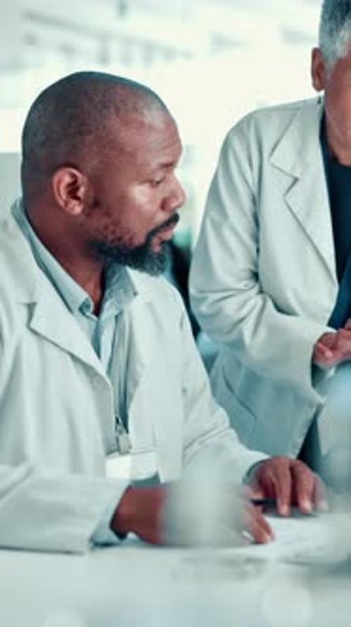 Scientists Collaborating on Research in Bright Laboratory