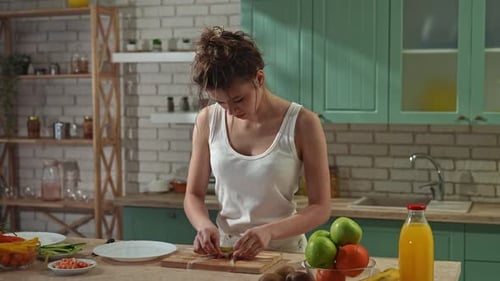 Young Woman at the Table in the Kitchen Preparing Spring Rolls for Healthy Lunch Rolls Thin Wrapper