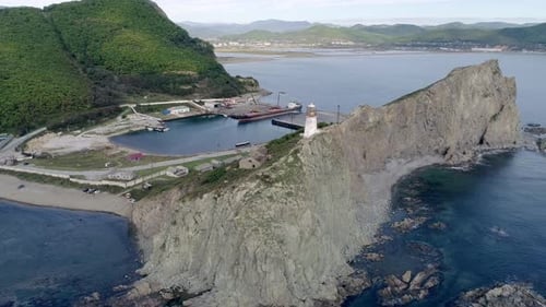 Aerial View of Rocky Cliff with an Old Lighthouse on Pacific Coast Beautiful Panoramic Seascape