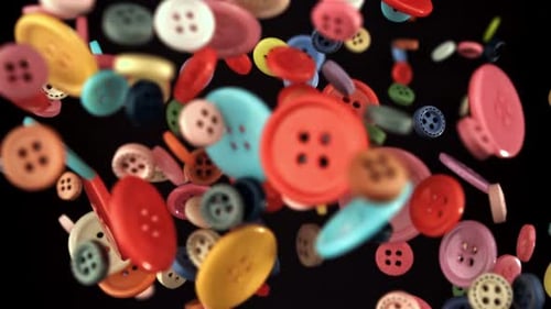 Multicolored Sewing Buttons Fly on a Black Background Filmed on a Highspeed Camera at 1000 Fps