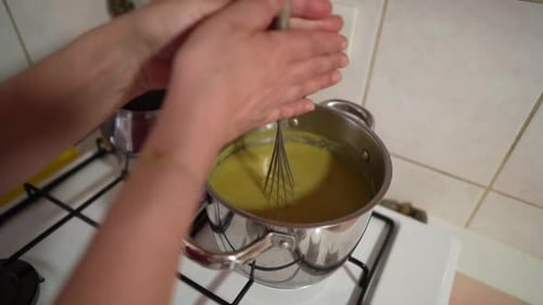 Whisk Stirring Sauce in a Pot