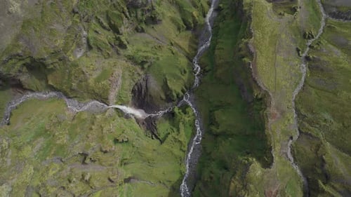 Aerial view of a stream of water in Mulagljufur Canyon, Iceland.