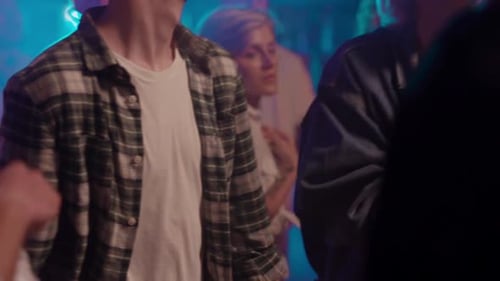 Dynamic Club Scene with Diverse Young People Dancing and Enjoying