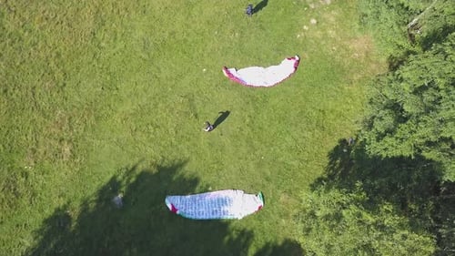 Paragliders waiting for the perfect moment to fly Extreme sport of paragliding. Prepare to fly.