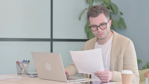 Young Professional Working, Celebrating Success in Office