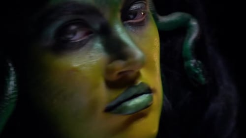 Woman with Green Skin and Snakes Hairstyle