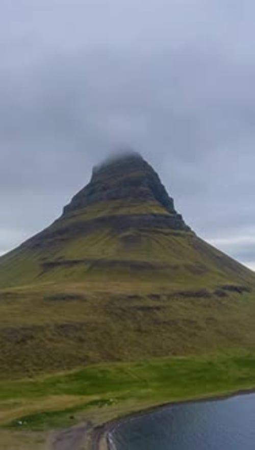 Kirkjufell Mountain in Summer Day Iceland Aerial View Vertical Video
