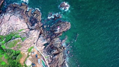 Aerial Top view of a transparent blue sea with beautiful waves at sunny day in summer. air of ocean