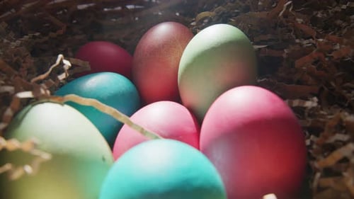 Colorful Easter Eggs Nestled in Brown Paper Shreds