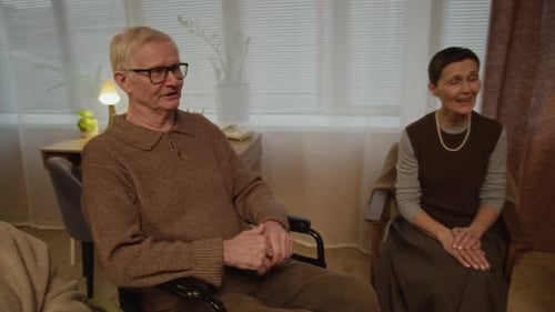 Multiethnic Seniors Enjoying Singing to Guitar in Nursing Home