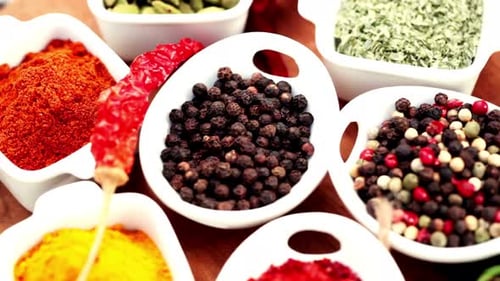 Colorful Spices: Aromatic Culinary Ingredients in White Bowls