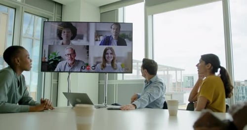 Businesspeople Having a Video conference in a Office Meeting room