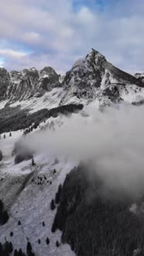 Fronalpstock mountain Glarus Switzerland Swiss Alps winter snow covered, aerial drone