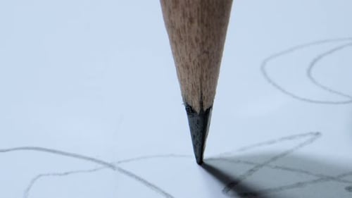 Pencil Sketching Abstract Lines on White Paper