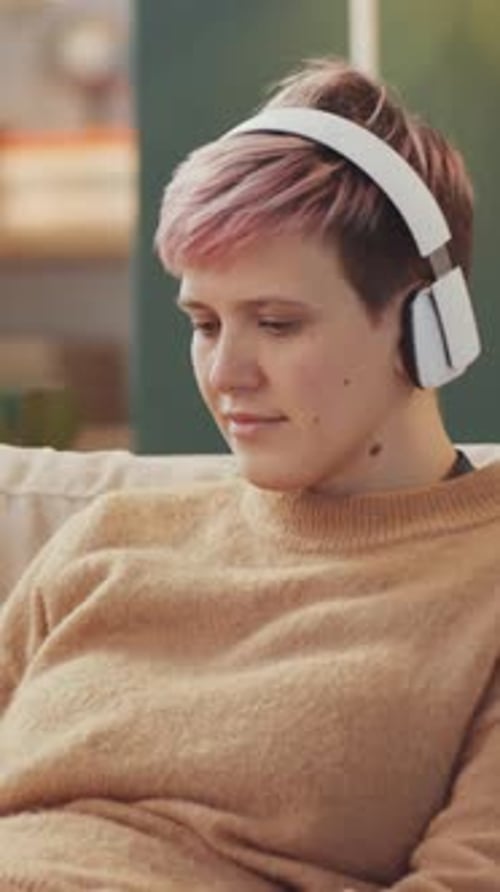 Young Adult Listening to Music on Headphones