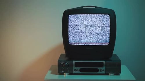 Vintage Television Displaying Static on VCR Player