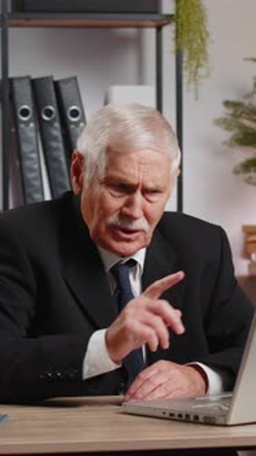 Senior Businessman Working on Laptop at Home Office Desk Talk on Online Communication Video Call