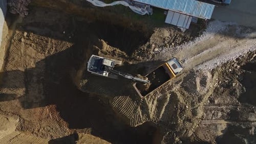 Aerial Video of Excavator Loading Earth in Vehicle