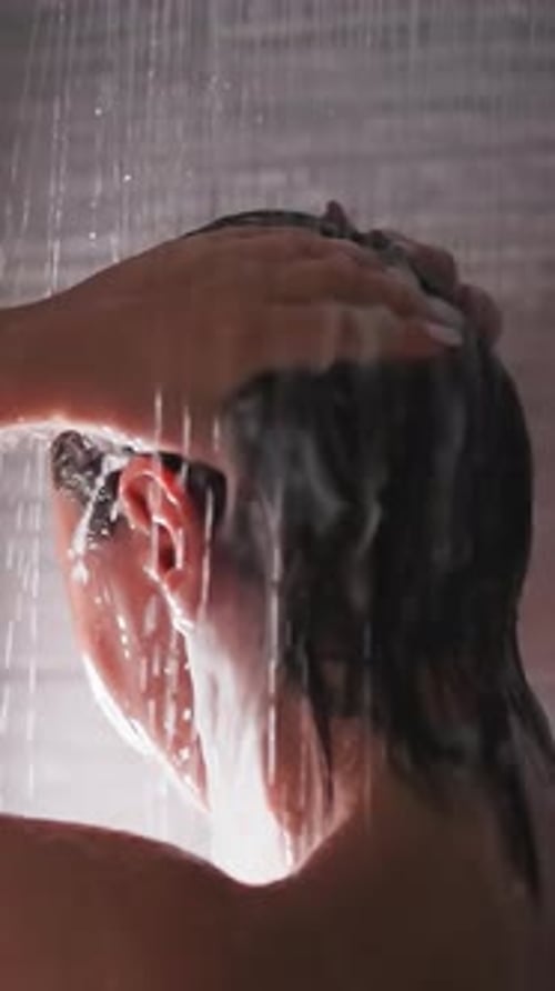 Woman Washing Hair in Shower