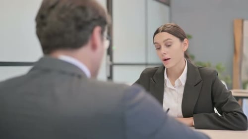 Business Meeting in an Office with Two Colleagues