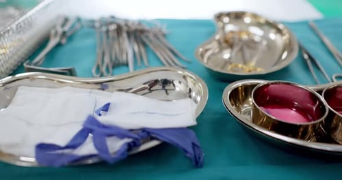 Surgery tools, equipment and metal on desk in hospital, operation theatre or clinic