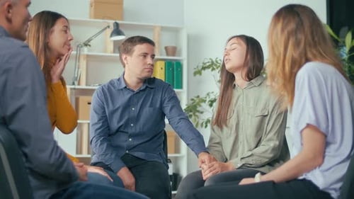 People in Group Therapy Session Sit in Circle