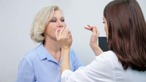 Beautician Gives Consultations to Woman in Beauty Clinic
