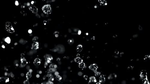Water Droplets Rise and Fall on a Black Background Filmed on a Highspeed Camera at 1000 Fps