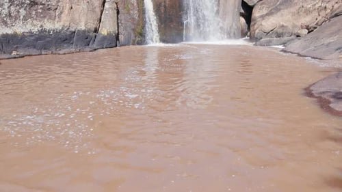 Drone aerial shot approaching a tropical waterfall In Brazil