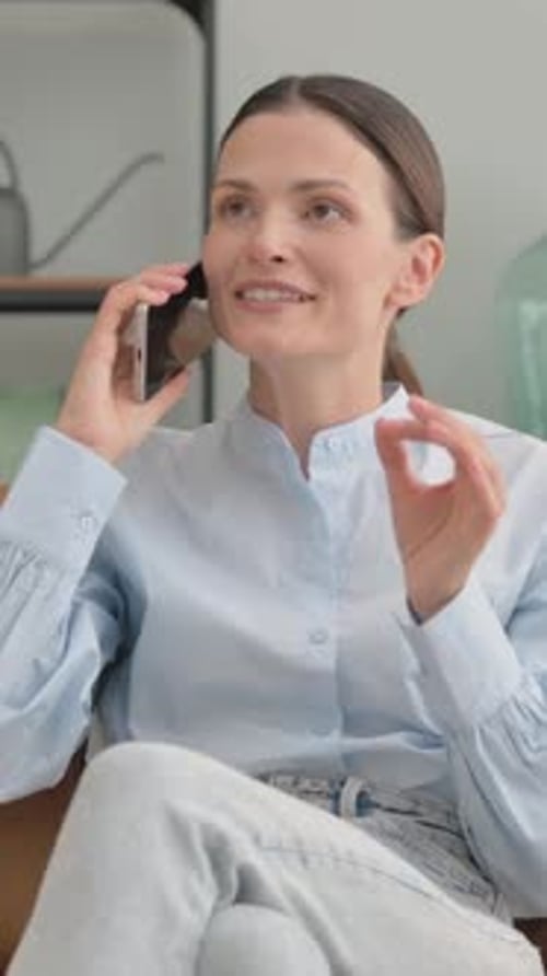 Attractive Woman Talking on Phone Indoors