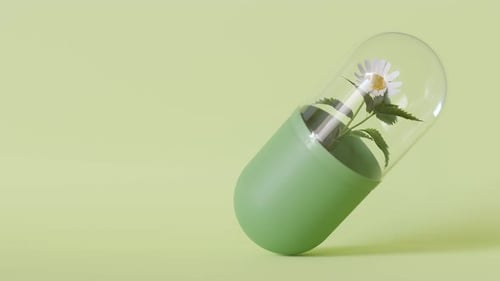 Homeopathic Pill On Green Background With Copy Space