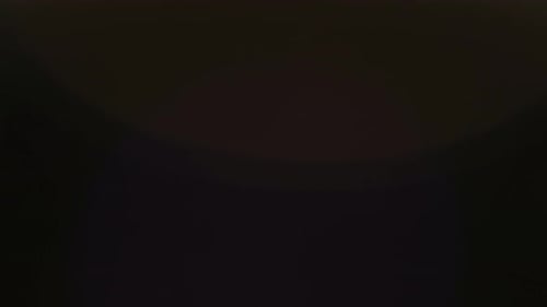 Abstract Overlay with Fast Moving Faded Yellow Light Lens Flare Blurred Effects on Dark Background